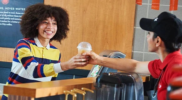 student getting beverage